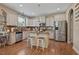 Well-equipped kitchen with stainless steel appliances, granite countertops, an island and wooden cabinets at 15 Scuppernong Ln, Lillington, NC 27546