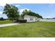 Outbuilding featuring an oversized garage door, and generous parking at 15 Scuppernong Ln, Lillington, NC 27546
