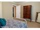 Bedroom showcasing an antique wardrobe and patterned bedding at 1500 Brent Ct # 9B, Burlington, NC 27215