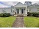 The building has a well-manicured lawn and flowers at 1500 Brent Ct # 9B, Burlington, NC 27215