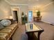 Comfortable living room showcases a sofa, coffee table and a view to dining area at 1500 Brent Ct # 9B, Burlington, NC 27215