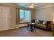 Cozy living room features a ceiling fan and a large window for natural light at 1500 Brent Ct # 9B, Burlington, NC 27215