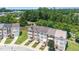 Aerial view of townhomes, highlighting landscaping, architectural details, lawns, and surrounding community at 1527 Haywards Heath Ln, Apex, NC 27502