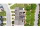 Aerial view of well-maintained townhomes with green lawns, mature trees, and convenient parking at 1527 Haywards Heath Ln, Apex, NC 27502