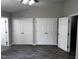 Spacious bedroom featuring modern floors, a ceiling fan and double door closets at 1527 Haywards Heath Ln, Apex, NC 27502