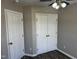 Bedroom features hardwood floors, fan, and closet, ideal for comfort and storage at 1527 Haywards Heath Ln, Apex, NC 27502