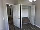Bedroom featuring wood floors and walk-in closet with a modern design at 1527 Haywards Heath Ln, Apex, NC 27502