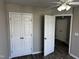 Bedroom features hardwood floors, fan, and closet, ideal for comfort and storage at 1527 Haywards Heath Ln, Apex, NC 27502