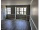 Bright bedroom with modern color scheme and large windows at 1527 Haywards Heath Ln, Apex, NC 27502