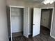 Bedroom featuring wood floors and closet with a modern design at 1527 Haywards Heath Ln, Apex, NC 27502
