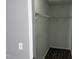 Walk-in closet with modern floors and wire shelving at 1527 Haywards Heath Ln, Apex, NC 27502