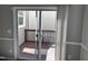 A deck with wood floors has sliding doors that lead inside and a wood railing at 1527 Haywards Heath Ln, Apex, NC 27502