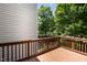 Exterior shot of deck overlooking a treed backyard at 1527 Haywards Heath Ln, Apex, NC 27502