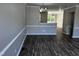 Bright dining room with view into living room and kitchen at 1527 Haywards Heath Ln, Apex, NC 27502