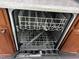 Interior of a stainless steel Whirlpool dishwasher with clean racks at 1527 Haywards Heath Ln, Apex, NC 27502