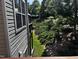 Exterior view from deck showing a sloping, green lawn and siding on the home at 1527 Haywards Heath Ln, Apex, NC 27502
