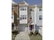 Charming townhome featuring an attached one-car garage, private entrance, and neutral exterior paint scheme at 1527 Haywards Heath Ln, Apex, NC 27502