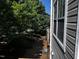 View from deck showing exterior of the home and yard with trees at 1527 Haywards Heath Ln, Apex, NC 27502