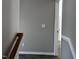Hallway with painted walls, laminate flooring, and white trim and doors at 1527 Haywards Heath Ln, Apex, NC 27502