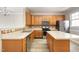 Kitchen featuring stainless steel appliances, an island, ample counter space, and stylish backsplash at 1527 Haywards Heath Ln, Apex, NC 27502