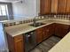Well-appointed kitchen featuring stainless steel appliances and modern countertops at 1527 Haywards Heath Ln, Apex, NC 27502