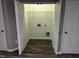 A look at the in-home laundry room with wood-look flooring at 1527 Haywards Heath Ln, Apex, NC 27502