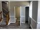 Living room with half bathroom and closet at 1527 Haywards Heath Ln, Apex, NC 27502