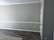 An empty living room has gray paint, white trim and baseboards, and wood floors at 1527 Haywards Heath Ln, Apex, NC 27502
