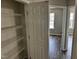 Spacious pantry featuring wire shelving, offering ample storage space for an organized kitchen at 1527 Haywards Heath Ln, Apex, NC 27502