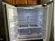 Interior view of a clean and organized Samsung refrigerator with clear shelves at 1527 Haywards Heath Ln, Apex, NC 27502