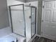 Modern shower with white tile surround at 1527 Haywards Heath Ln, Apex, NC 27502