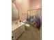 Bathroom features white vanity and blue marble shower curtain at 195 Windsong Ln, Youngsville, NC 27596