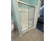 Bathroom features a shower with sliding glass doors at 195 Windsong Ln, Youngsville, NC 27596