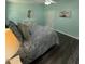 Cozy bedroom with soft lighting and ceiling fan at 195 Windsong Ln, Youngsville, NC 27596