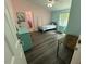 Cute bedroom features a daybed and wood-look floors at 195 Windsong Ln, Youngsville, NC 27596
