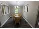 Charming dining room with classic decor, natural light, and comfortable seating at 195 Windsong Ln, Youngsville, NC 27596