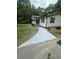 Inviting single-story home featuring a well-maintained lawn and a freshly painted walkway at 195 Windsong Ln, Youngsville, NC 27596
