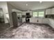 Spacious kitchen features stainless steel appliances, white cabinets, and stone-look floors at 195 Windsong Ln, Youngsville, NC 27596