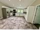 Bright kitchen with white cabinetry, stainless steel appliances, and a spacious layout at 195 Windsong Ln, Youngsville, NC 27596