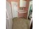 Laundry room has ample space with a folding table and a view into the living room at 195 Windsong Ln, Youngsville, NC 27596