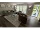 Inviting living room featuring ample natural light, stylish furnishings, and a welcoming atmosphere at 195 Windsong Ln, Youngsville, NC 27596