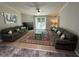 Spacious living room with hardwood floors, a fireplace, and comfortable seating at 195 Windsong Ln, Youngsville, NC 27596