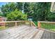 Enjoy a spacious wooden back deck overlooking a lush, green yard with a shed at 202 Crest Rd, Cary, NC 27513