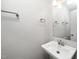 This half bathroom has a single sink with a mirror, a towel rack, and modern fixtures at 202 Crest Rd, Cary, NC 27513