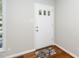 Bright entryway featuring fresh paint, hardwood floors, and a classic front door at 202 Crest Rd, Cary, NC 27513