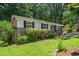 Charming single-story home with a manicured lawn, brick accents, and classic black shutters at 202 Crest Rd, Cary, NC 27513