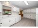 Spacious kitchen boasts ample cabinet space, a functional layout, and modern flooring for easy maintenance at 202 Crest Rd, Cary, NC 27513