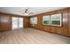Cozy living room with natural light and a ceiling fan offers a relaxing space with backyard access at 202 Crest Rd, Cary, NC 27513
