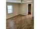 Bedroom with a window bringing in natural light and hardwood style flooring throughout at 207 2Nd St, Erwin, NC 28339