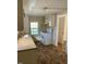 The kitchen has hardwood style flooring, white appliances, and a window for natural lighting at 207 2Nd St, Erwin, NC 28339